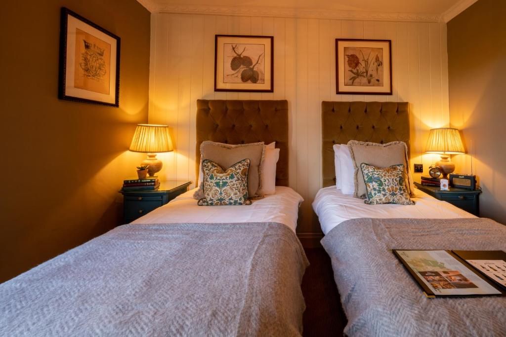 Uma cama ou camas num quarto em Prince of Burford