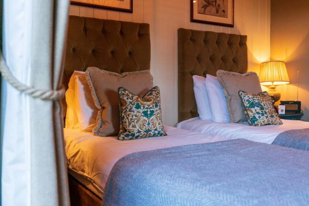 Uma cama ou camas num quarto em Prince of Burford