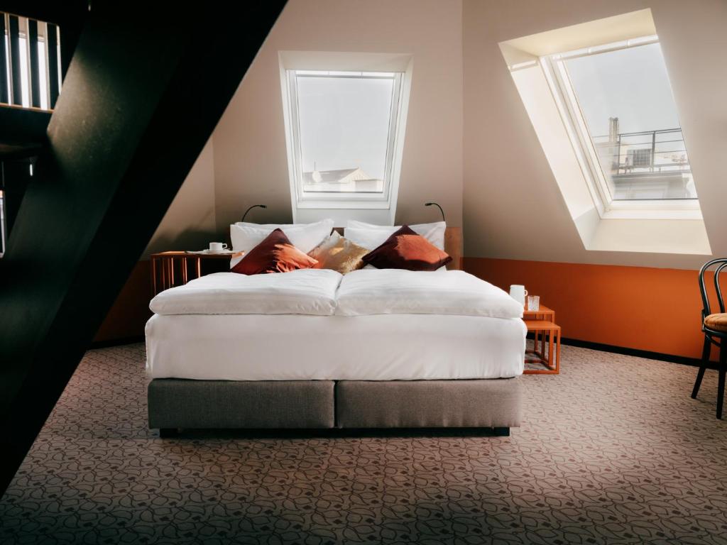 WELTWIEN Luxury Art Apartments & Free Parkingにあるベッド