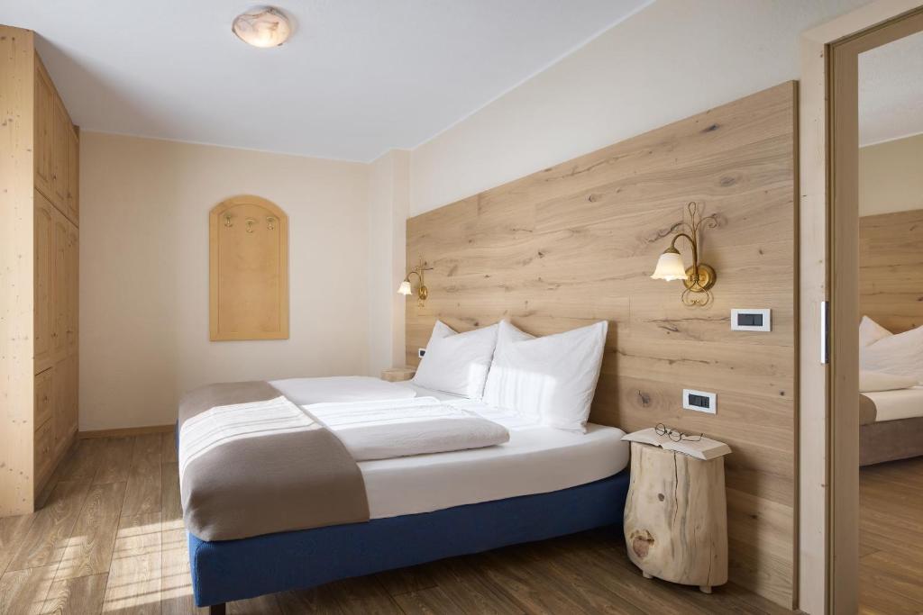 Postel nebo postele na pokoji v ubytování Hotel B&B Frohsinn