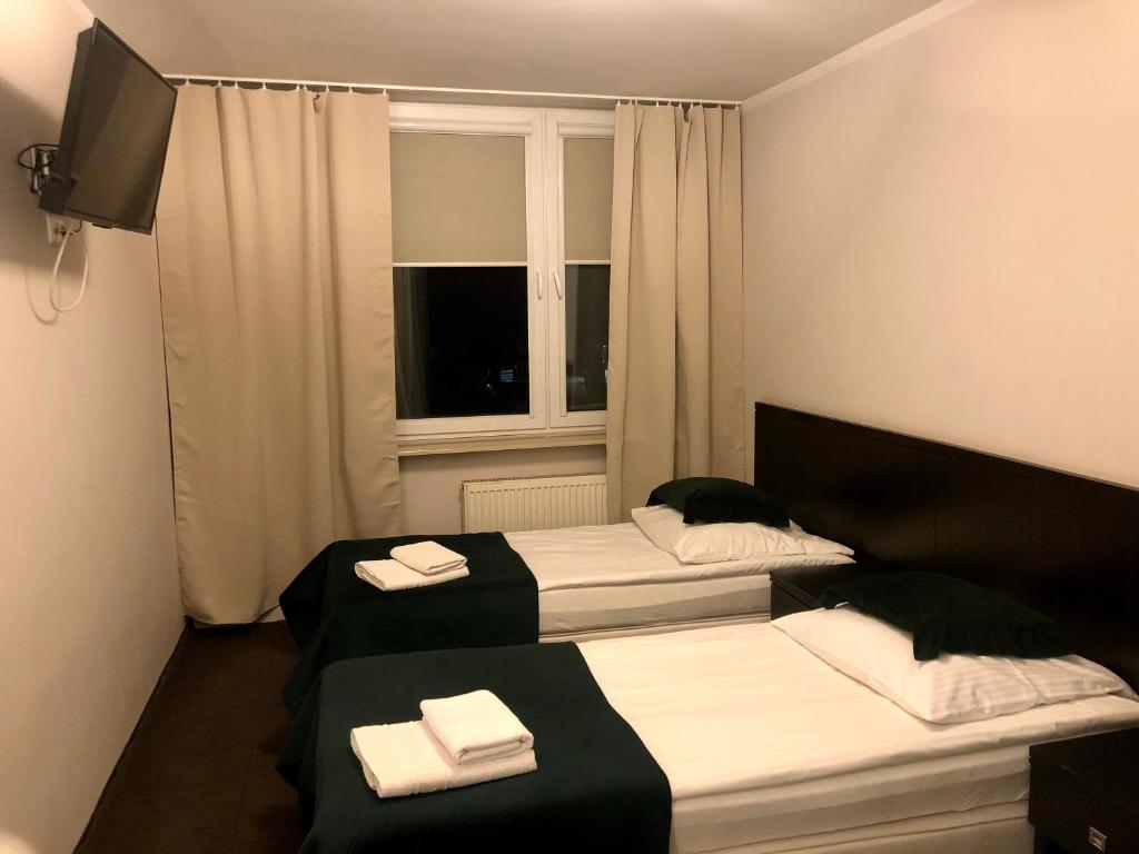 Postel nebo postele na pokoji v ubytování Sosnowe Zacisze