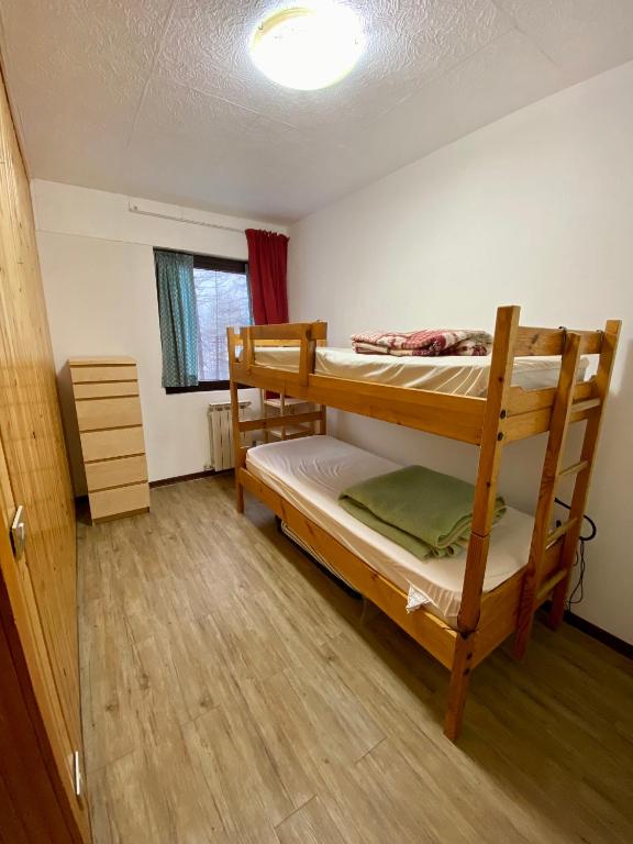 A bed or beds in a room at BlueSky Appartamento Monte Cervino Matterhorn