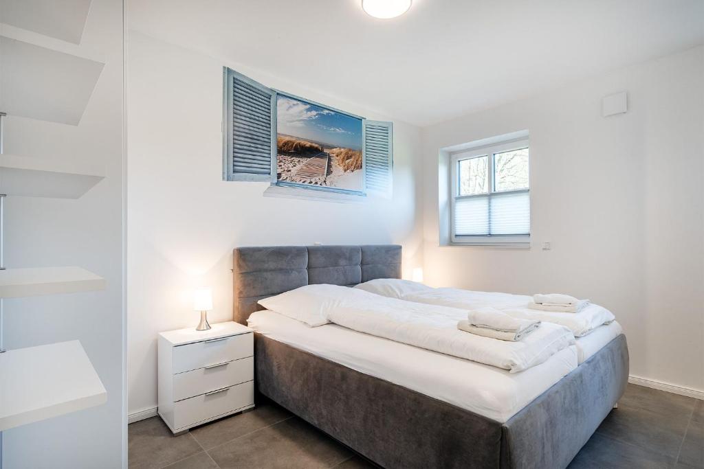 Postel nebo postele na pokoji v ubytování Ferienhaus Maira, mit Garten und Sauna