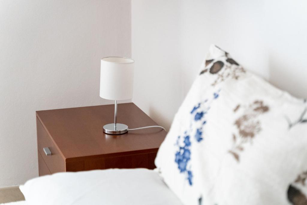 Postel nebo postele na pokoji v ubytování Spacious 3-Bedroom Apartment with Courtyard in Tempio Pausania - Perfect for Families