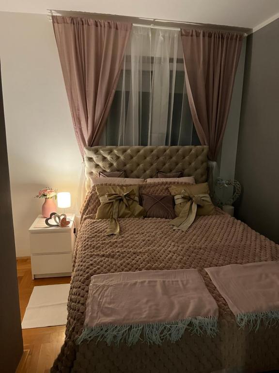 a bedroom with a large bed with a canopy at bona loca in Smederevska Palanka