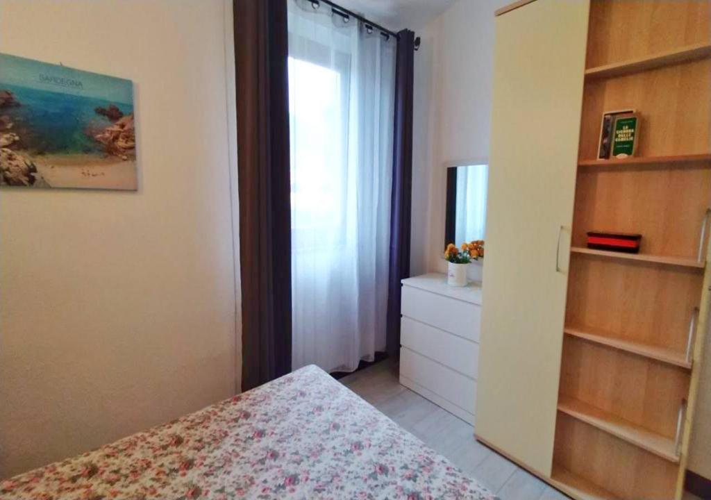 A bed or beds in a room at Paradise Flat - View, Garden & Parking (200Mt Sea)