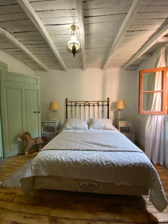 a bedroom with a large bed in a room at Uva Dulce in Tunca Arriba