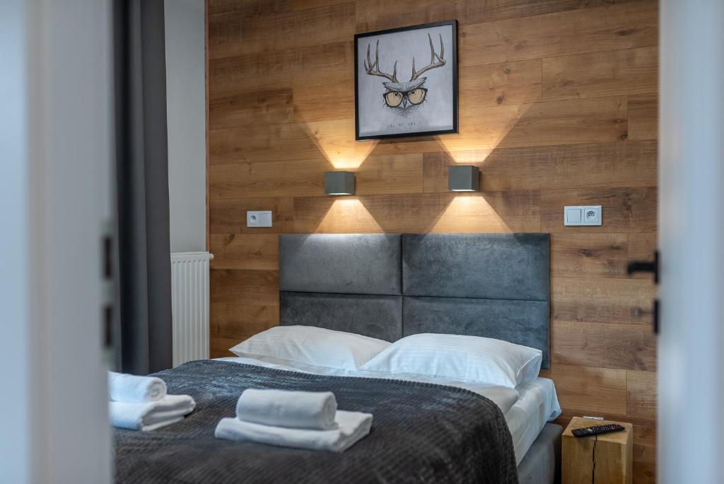 Posteľ alebo postele v izbe v ubytovaní Apartament Słowackiego