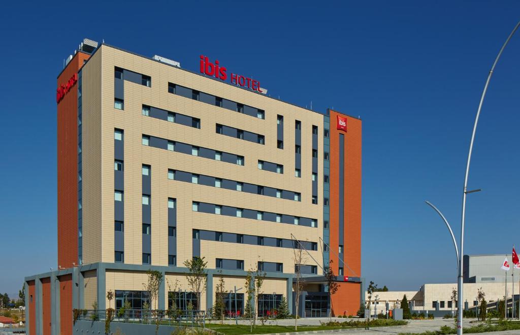 a large building with a ups store sign on it at ibis Ankara Airport Hotel in Ankara