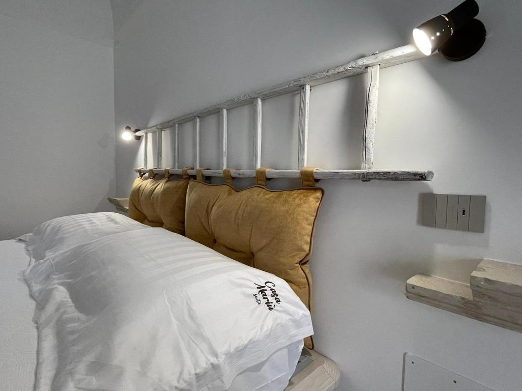 Una cama o camas en una habitación de Casa Mariù