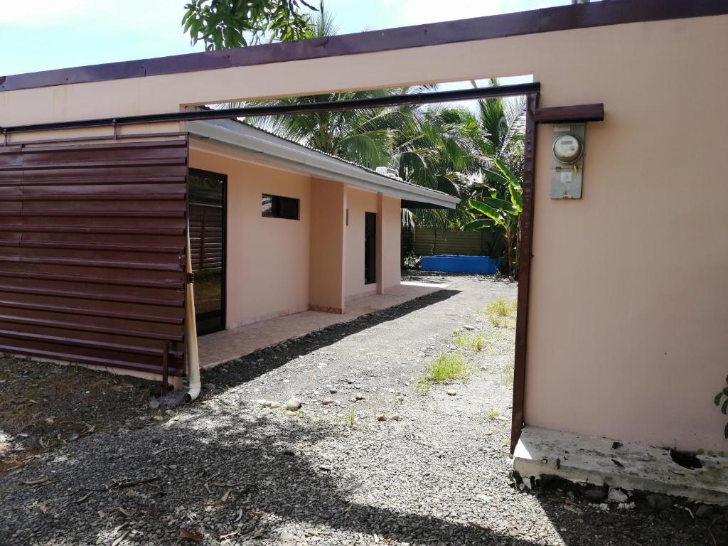 an entrance to a building with an open door at Casa début Surf Place in Parrita