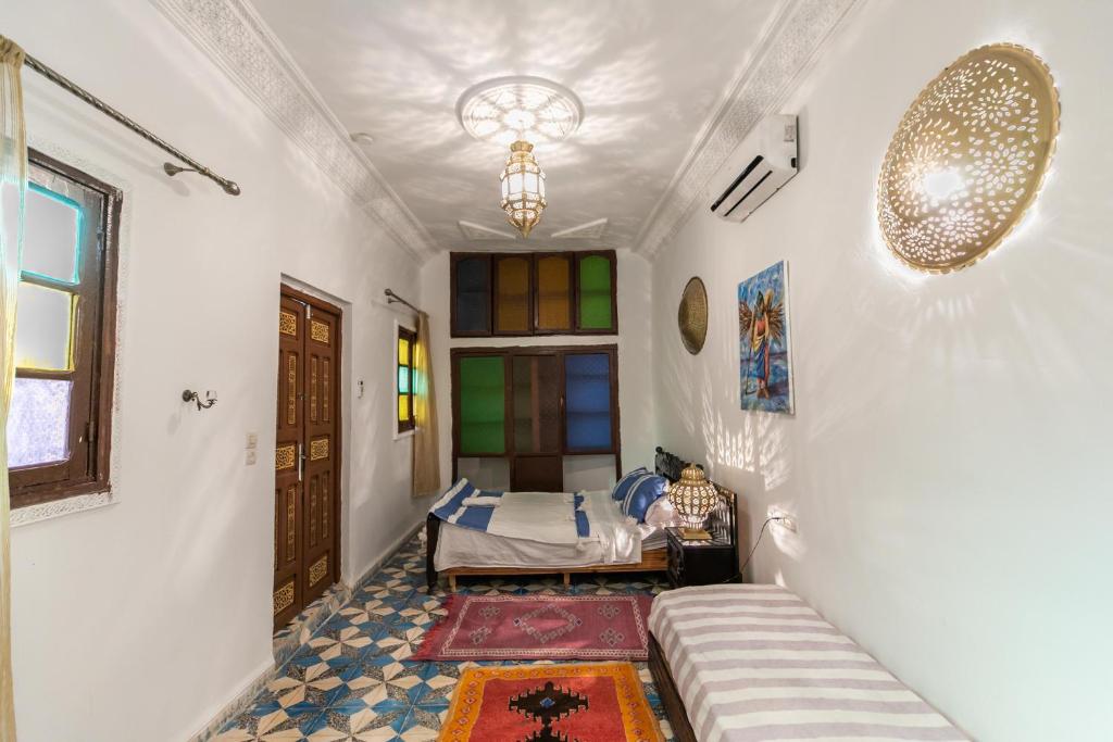 Postel nebo postele na pokoji v ubytování Riad bel kayed