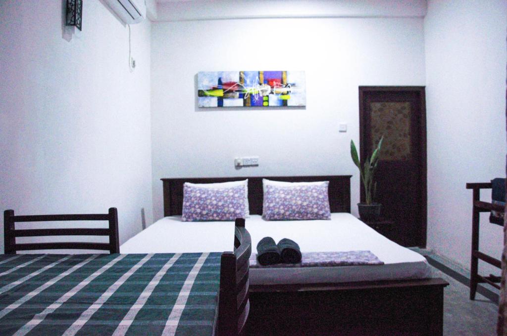 Voodi või voodid majutusasutuse Gem Light Guest House toas