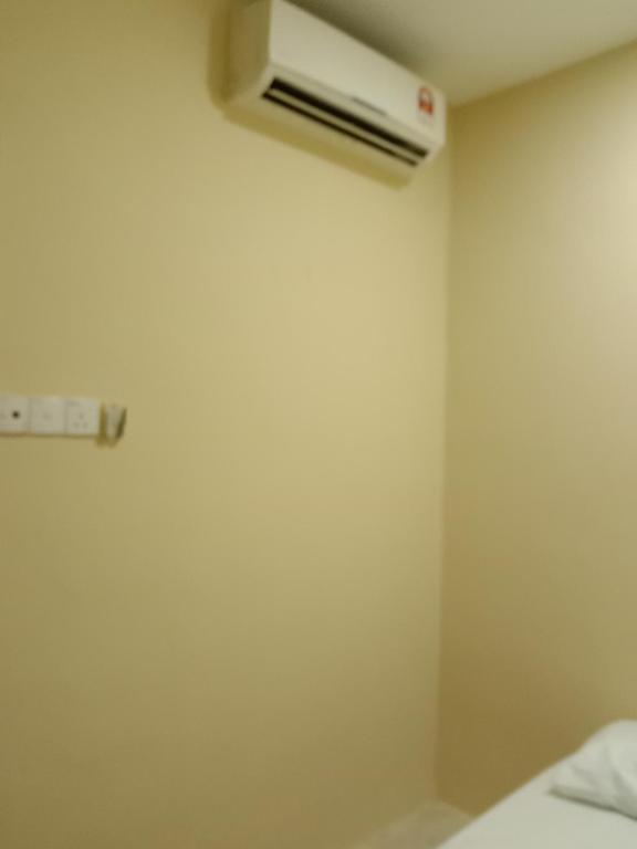 Postel nebo postele na pokoji v ubytování RAS Hotel