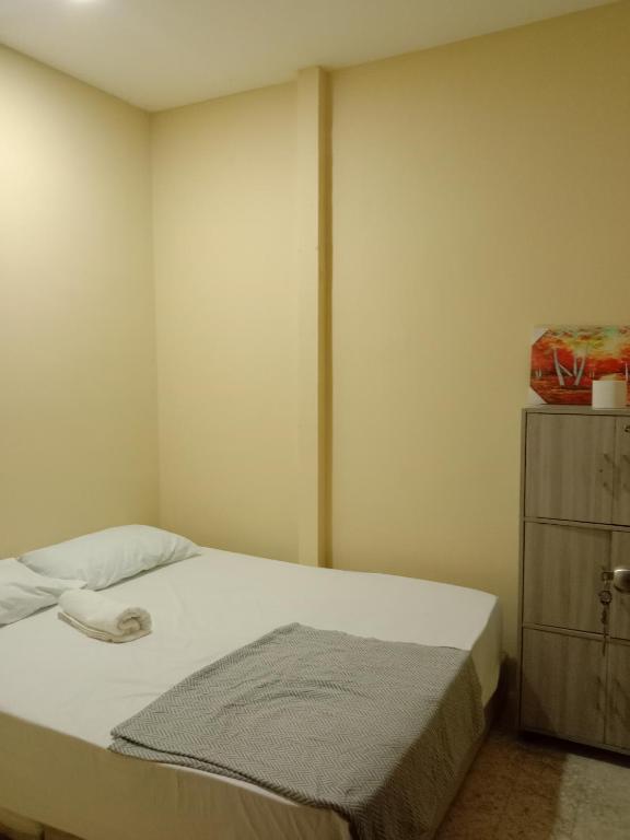 Postel nebo postele na pokoji v ubytování RAS Hotel