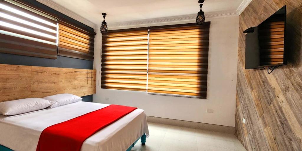 Postel nebo postele na pokoji v ubytování Hotel Murali - Cerca del Aeropuerto de Guayaquil