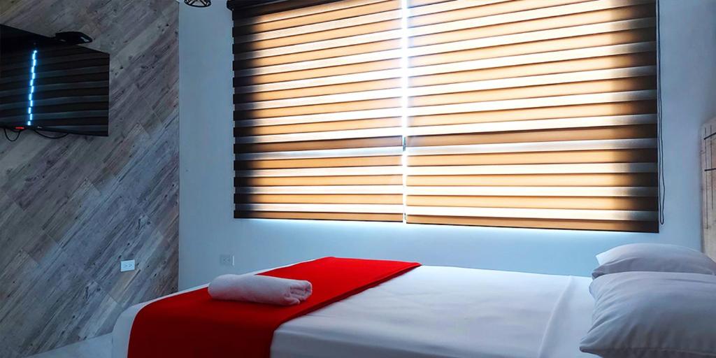 Postel nebo postele na pokoji v ubytování Hotel Murali - Cerca del Aeropuerto de Guayaquil