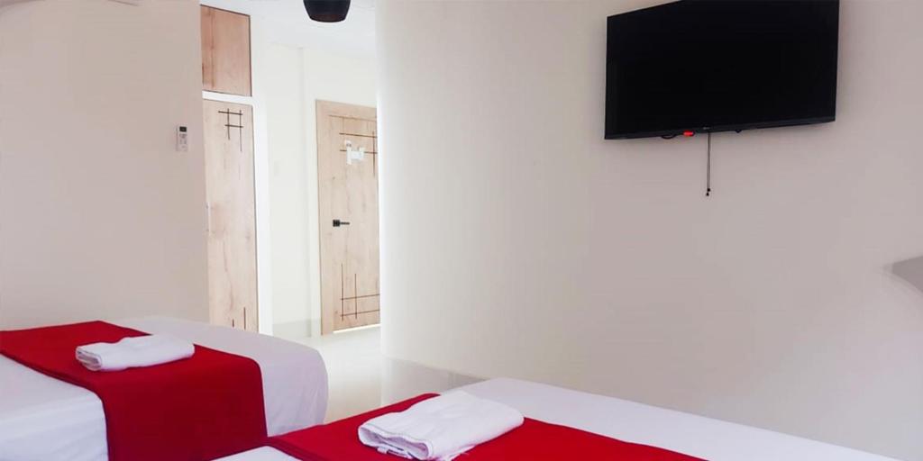 Postel nebo postele na pokoji v ubytování Hotel Murali - Cerca del Aeropuerto de Guayaquil