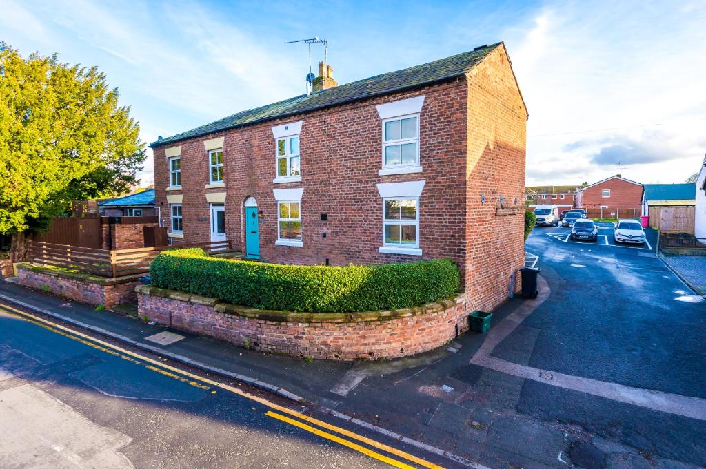 an aerial view of a brick building at Ivy House Luxury Cheshire Cottage for relaxation. Chester Zoo· in Saughall