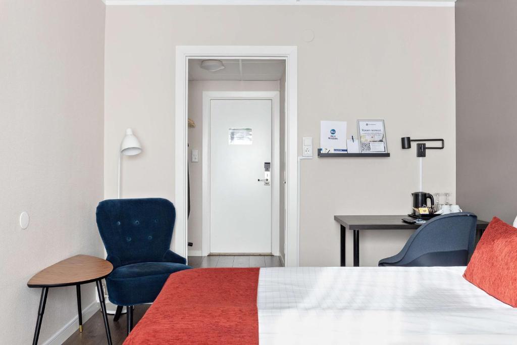 Postel nebo postele na pokoji v ubytování Best Western Hotel Savoy
