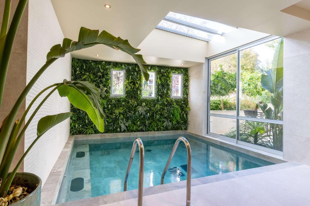 a pool in a house with a plant at Best Western Hotel & SPA Coeur De Cassis in Cassis