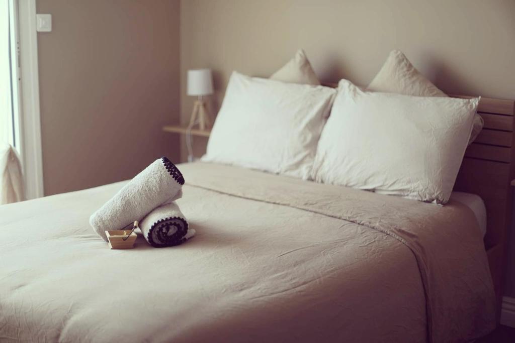 a stuffed animal sitting on top of a bed at Chez Julien & Mathieu in Valras-Plage