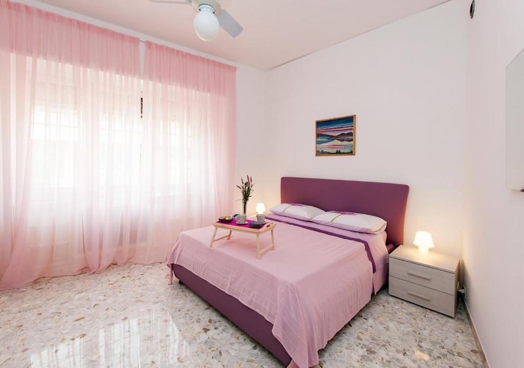 A bed or beds in a room at Residenza dei Pontefici