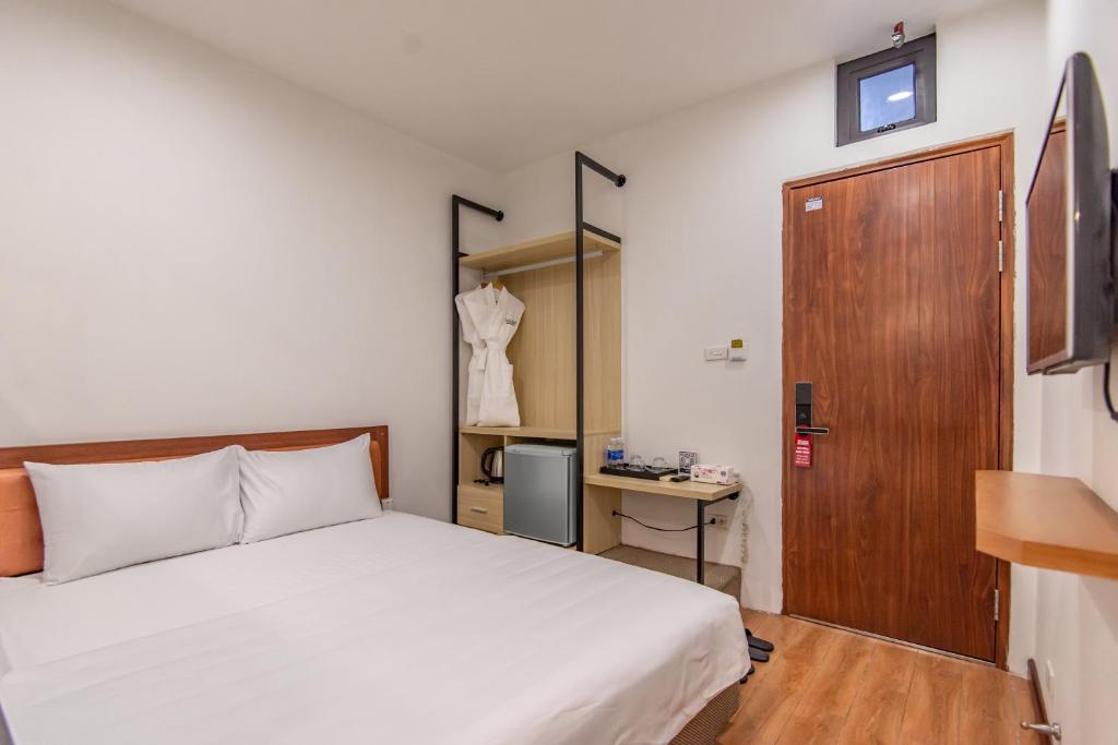 Postel nebo postele na pokoji v ubytování Coco Hotel Cau Giay