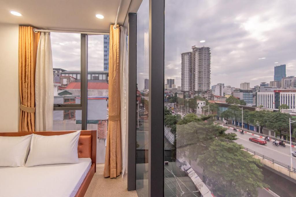 Postel nebo postele na pokoji v ubytování Coco Hotel Cau Giay