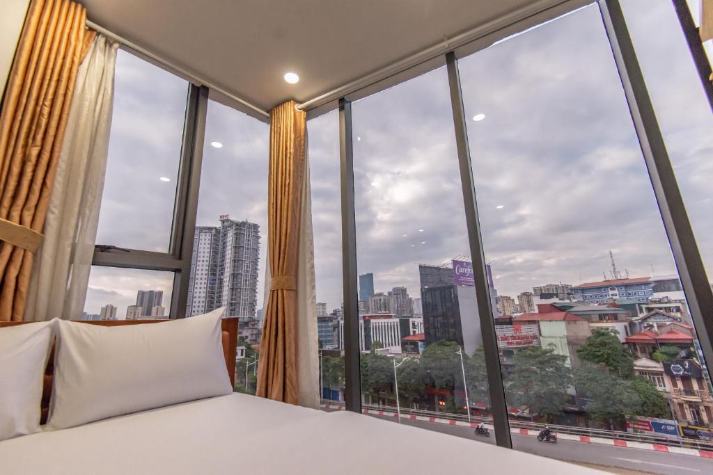 Postel nebo postele na pokoji v ubytování Coco Hotel Cau Giay