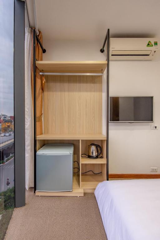 Postel nebo postele na pokoji v ubytování Coco Hotel Cau Giay