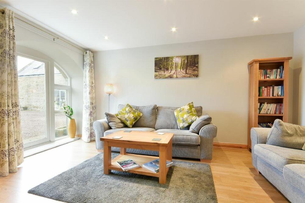 a living room with a couch and a coffee table at East Havers in Alnwick