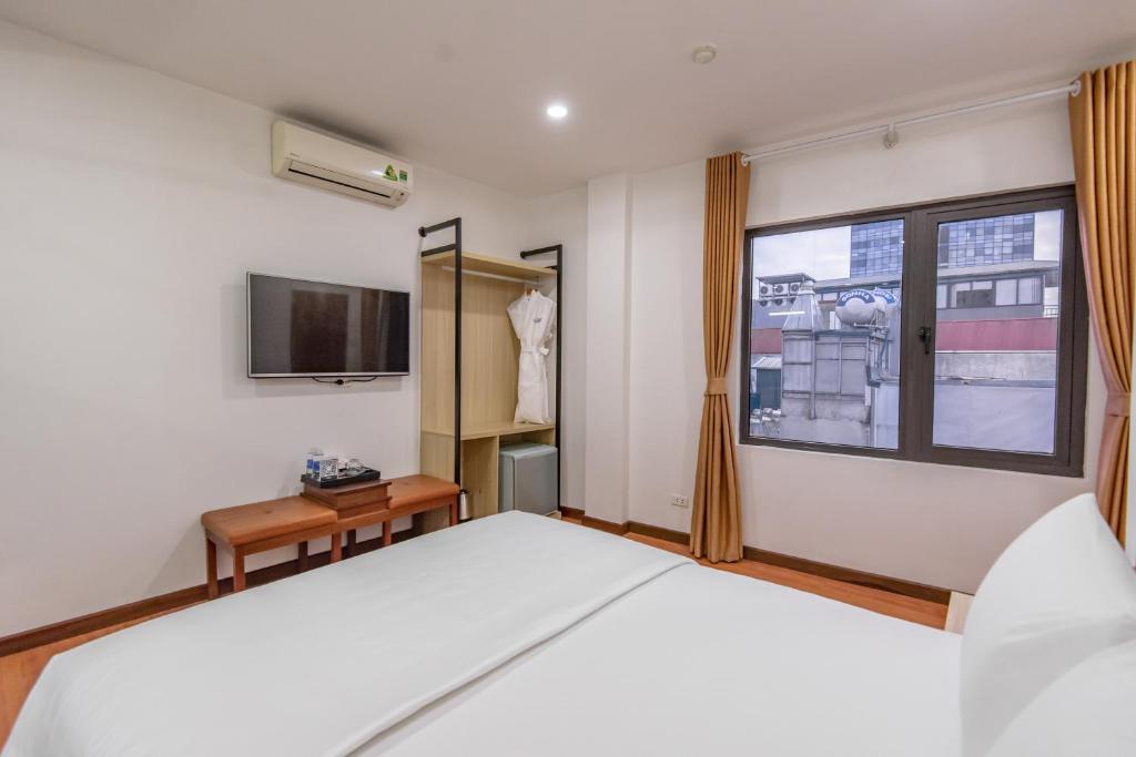 Postel nebo postele na pokoji v ubytování Coco Hotel Cau Giay