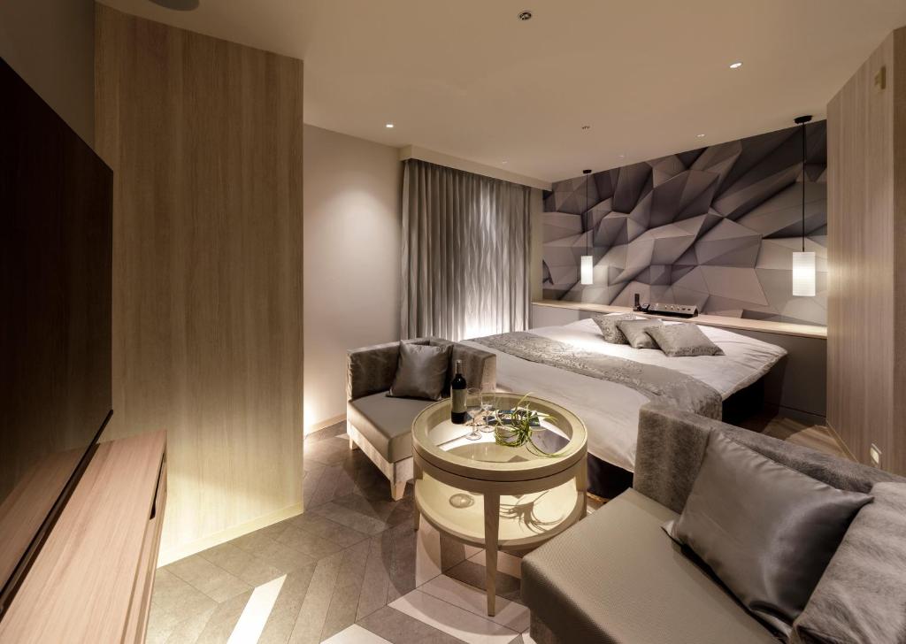 Postel nebo postele na pokoji v ubytování Hotel Cocoon -Urban Luxury-
