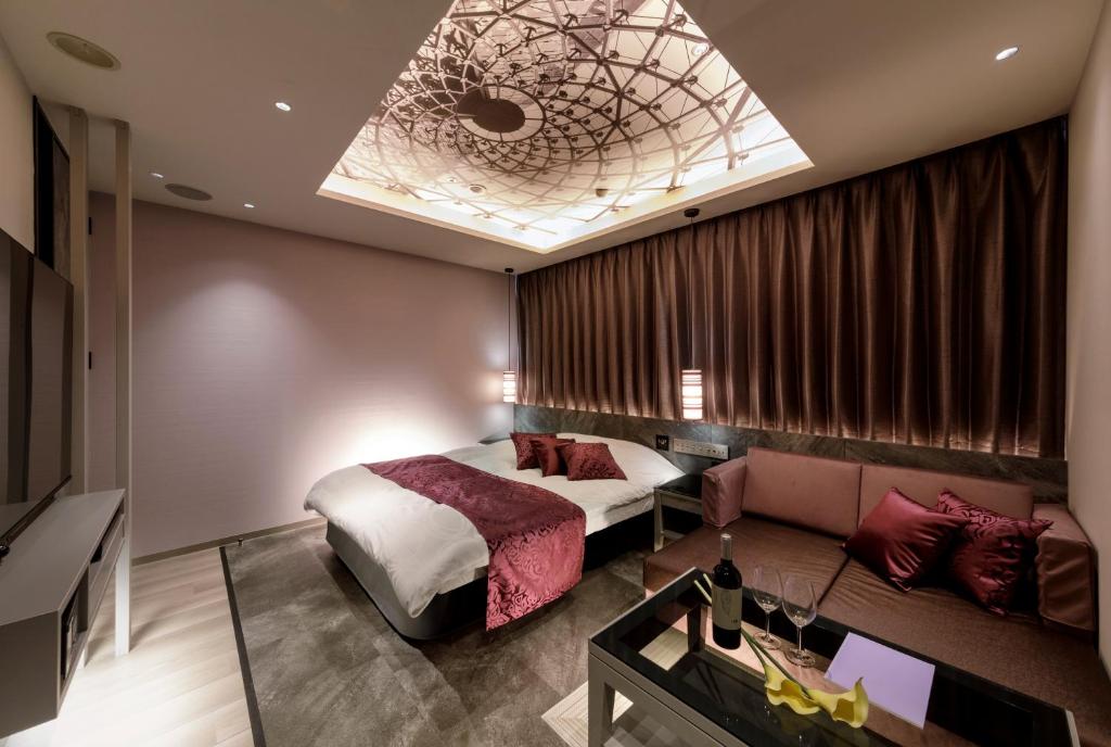 Postel nebo postele na pokoji v ubytování Hotel Cocoon -Urban Luxury-