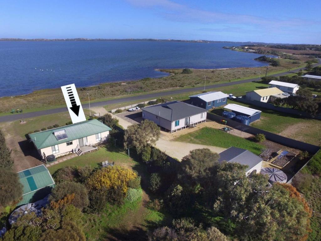 an aerial view of a house with the water at Coorong Lakeside Cottage in Meningie