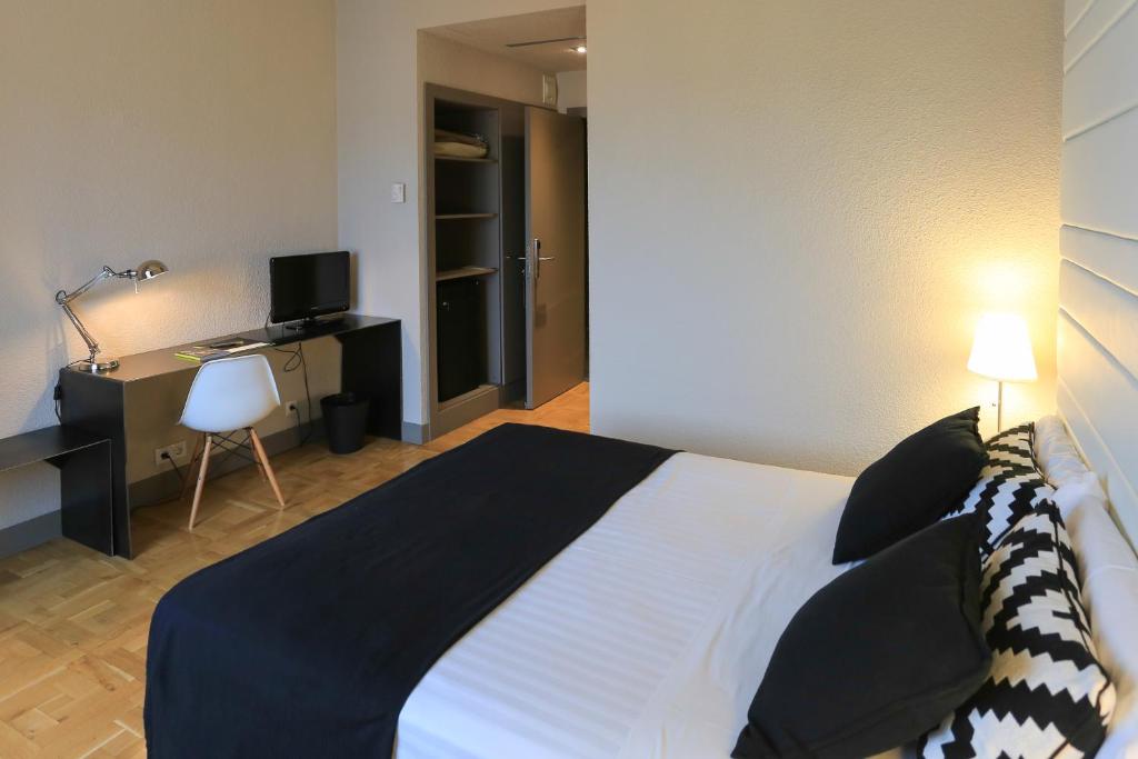 Postel nebo postele na pokoji v ubytování Habitus Hotel Leyre