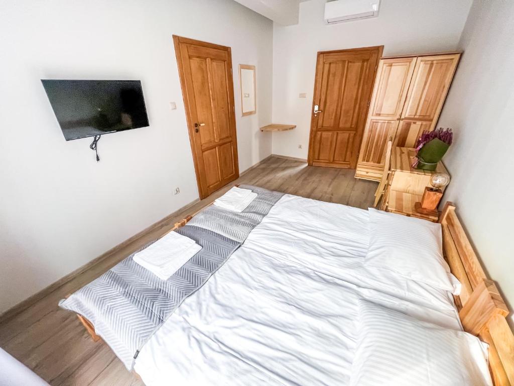 Postel nebo postele na pokoji v ubytování Gościniec Smrekowa Chata