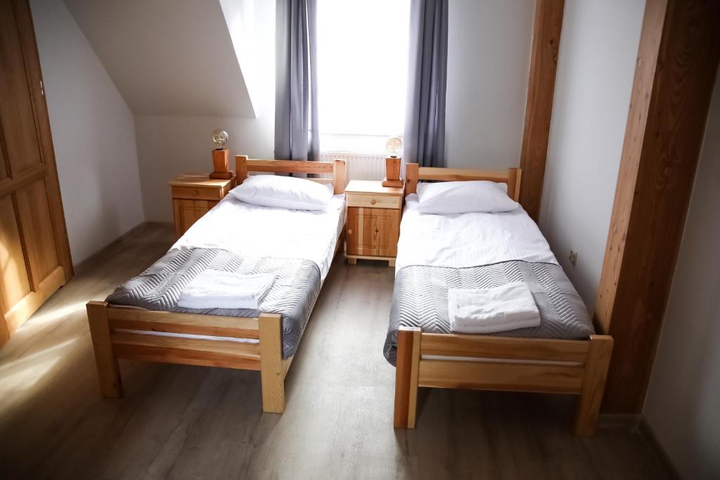 Postel nebo postele na pokoji v ubytování Gościniec Smrekowa Chata