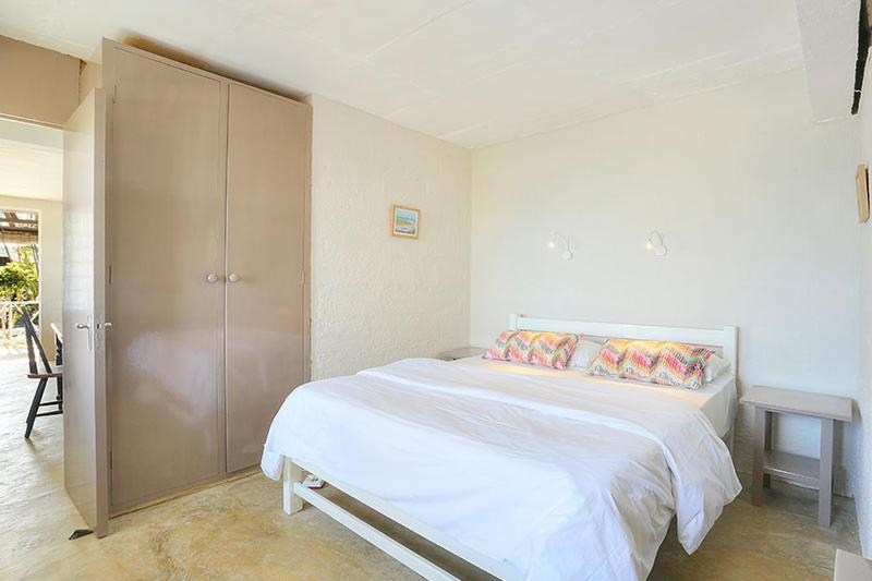 Postel nebo postele na pokoji v ubytování Fantaisie Lodges