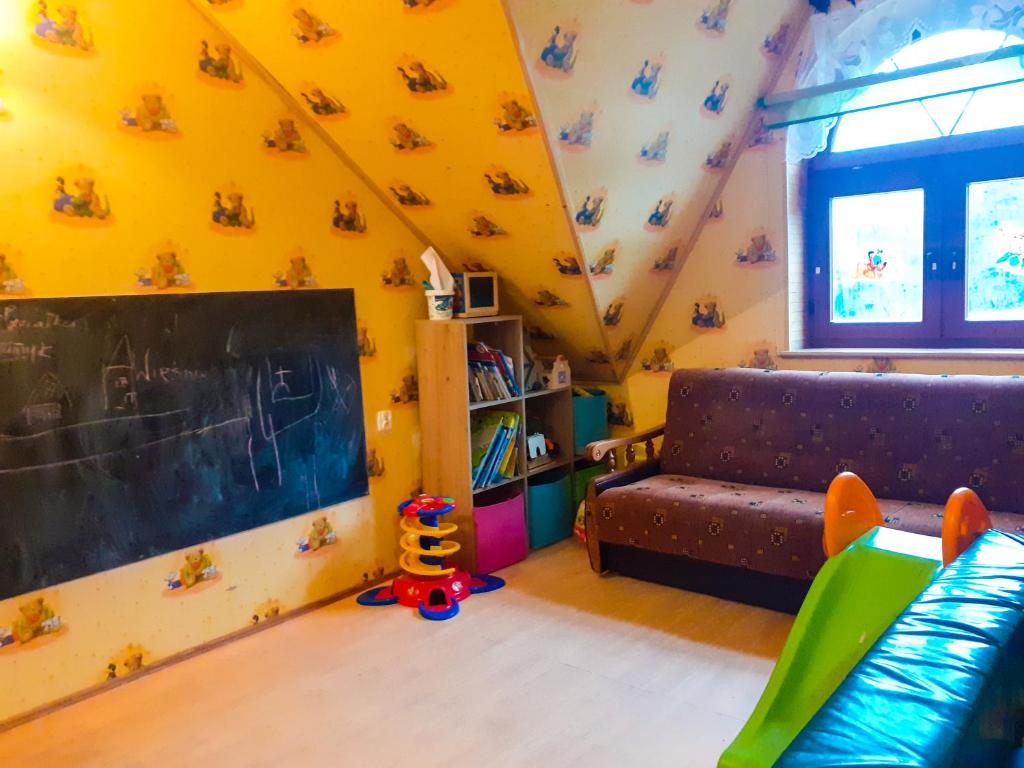 Postel nebo postele na pokoji v ubytování Agroturystyka Pod Złotą Wiechą