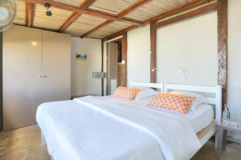 Postel nebo postele na pokoji v ubytování Fantaisie Lodges