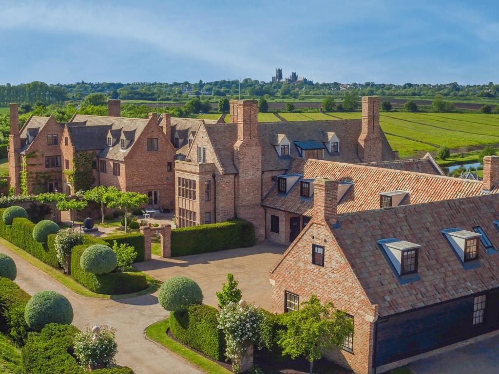 an aerial view of a large house with a yard at The Old Hall Ely in Ely