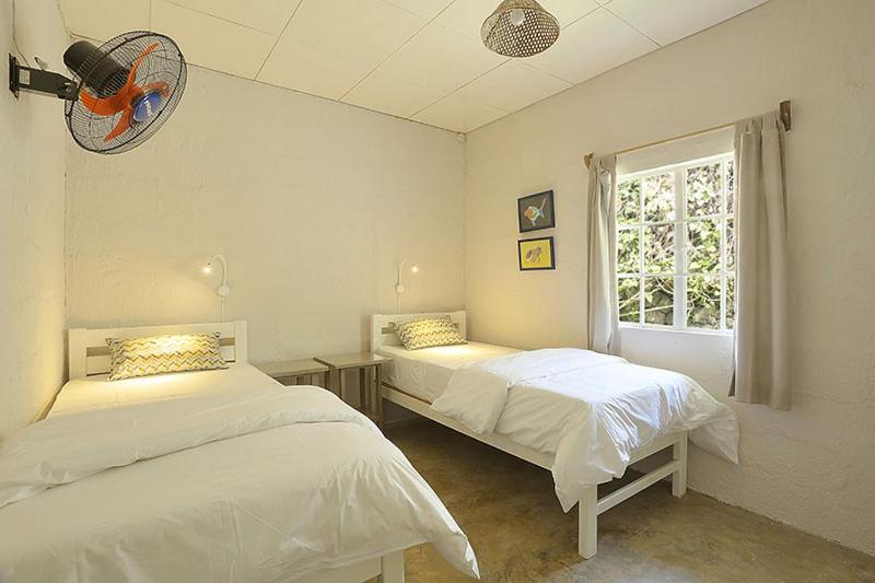 Postel nebo postele na pokoji v ubytování Fantaisie Lodges