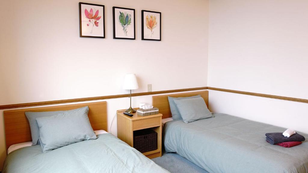 Postel nebo postele na pokoji v ubytování Refre Hotel