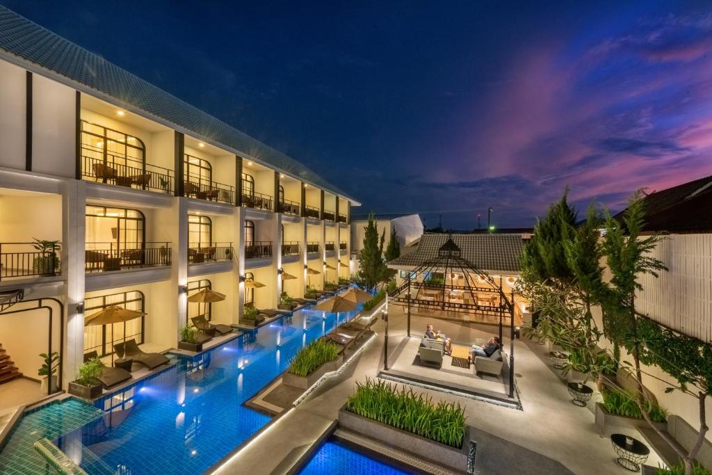 an image of a hotel with a swimming pool at Ai Pai Hotel in Pai