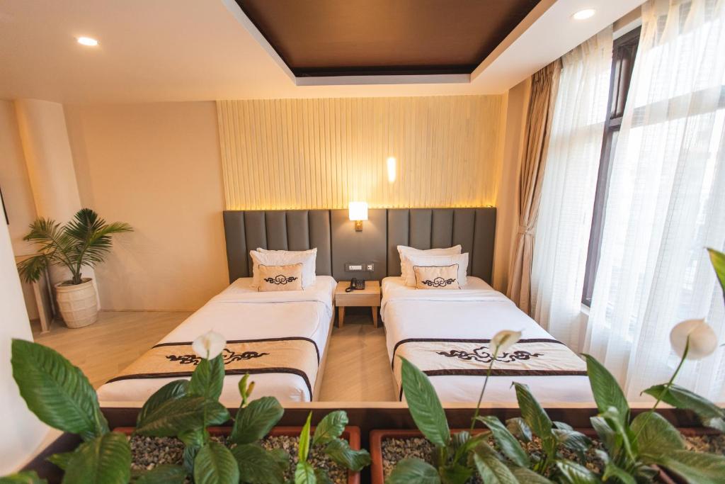Postel nebo postele na pokoji v ubytování Lavie Residence and Spa