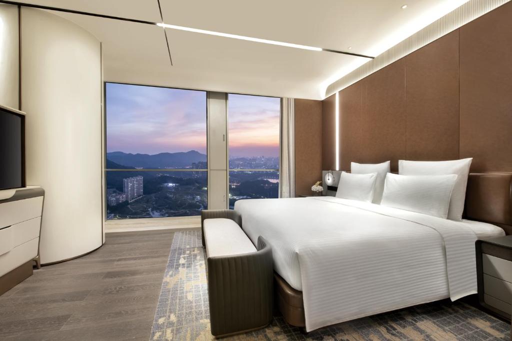 Postel nebo postele na pokoji v ubytování Pullman Shenzhen North