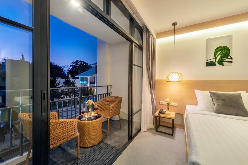 Postel nebo postele na pokoji v ubytování Ai Pai Hotel