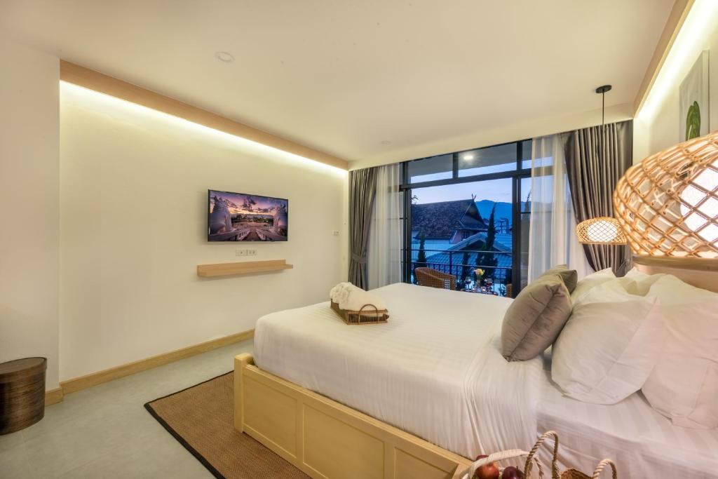 Postel nebo postele na pokoji v ubytování Ai Pai Hotel